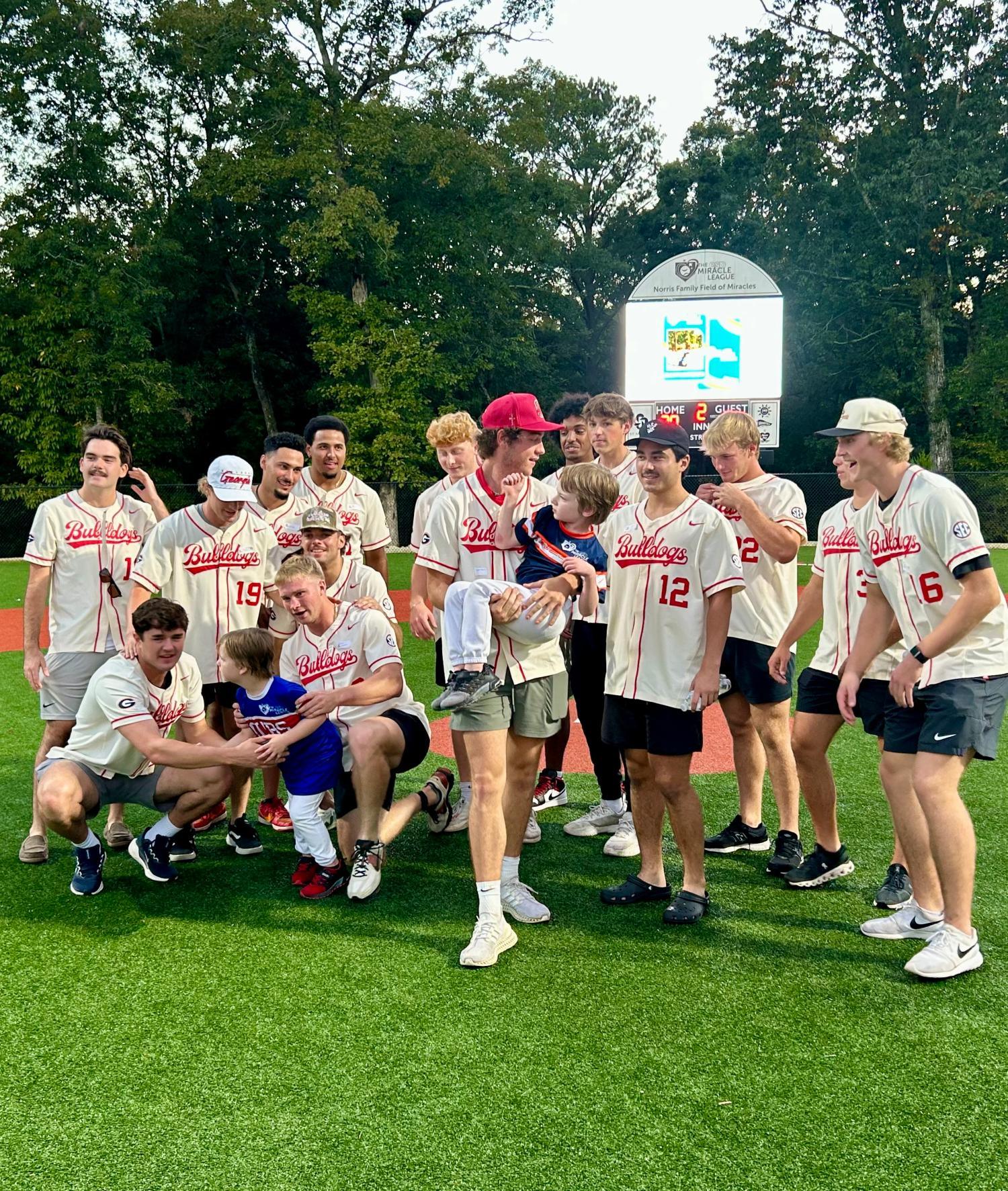Boys in baseball uniforms on a baseball field