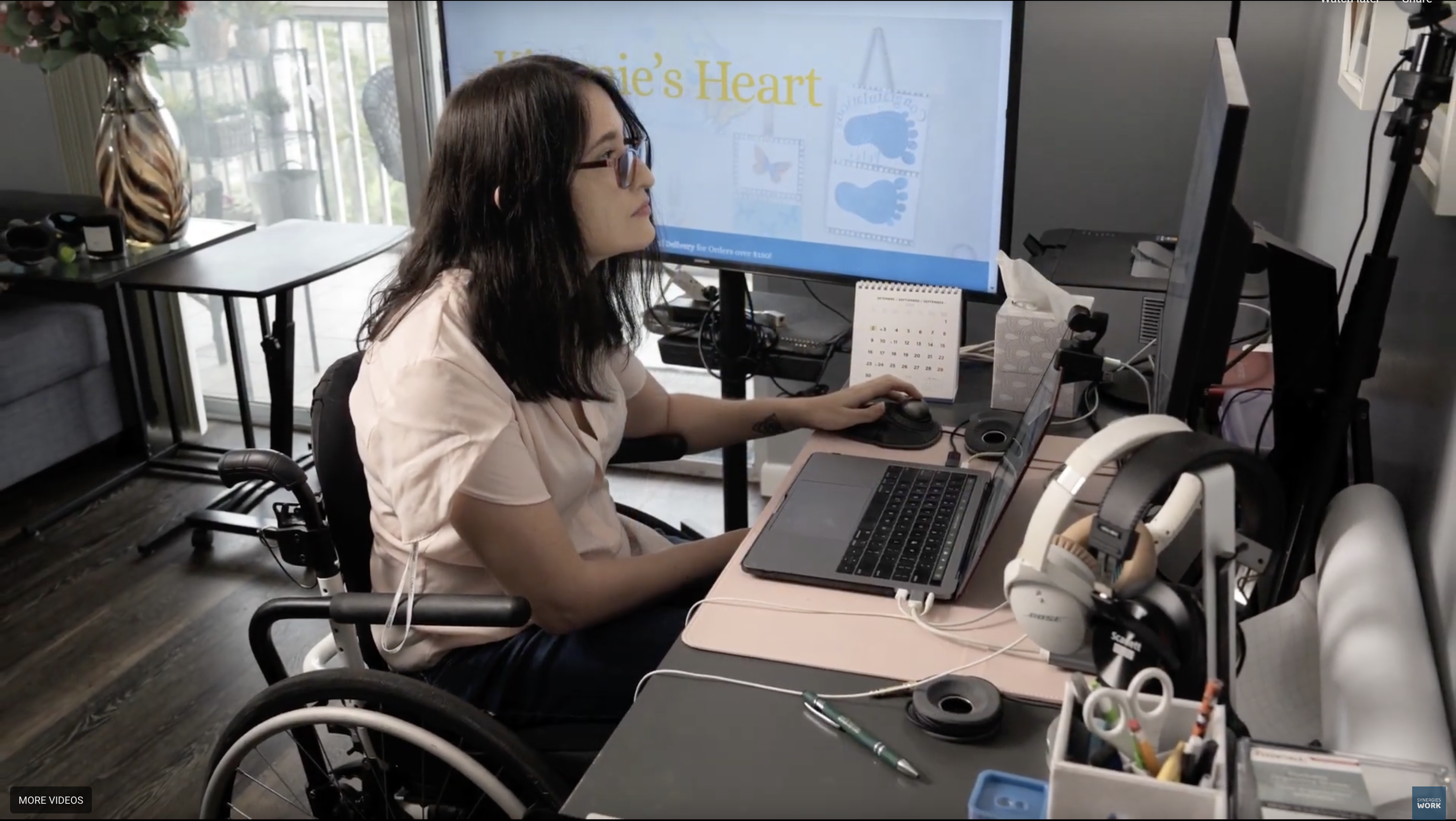 Paola Blanco working at her desk