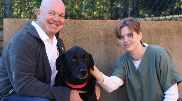 Sen Mike Dugan with Elizabeth Terzich, Doggie Day Care Animal Tech at Carrol County Animal Hospital in Carrolton.